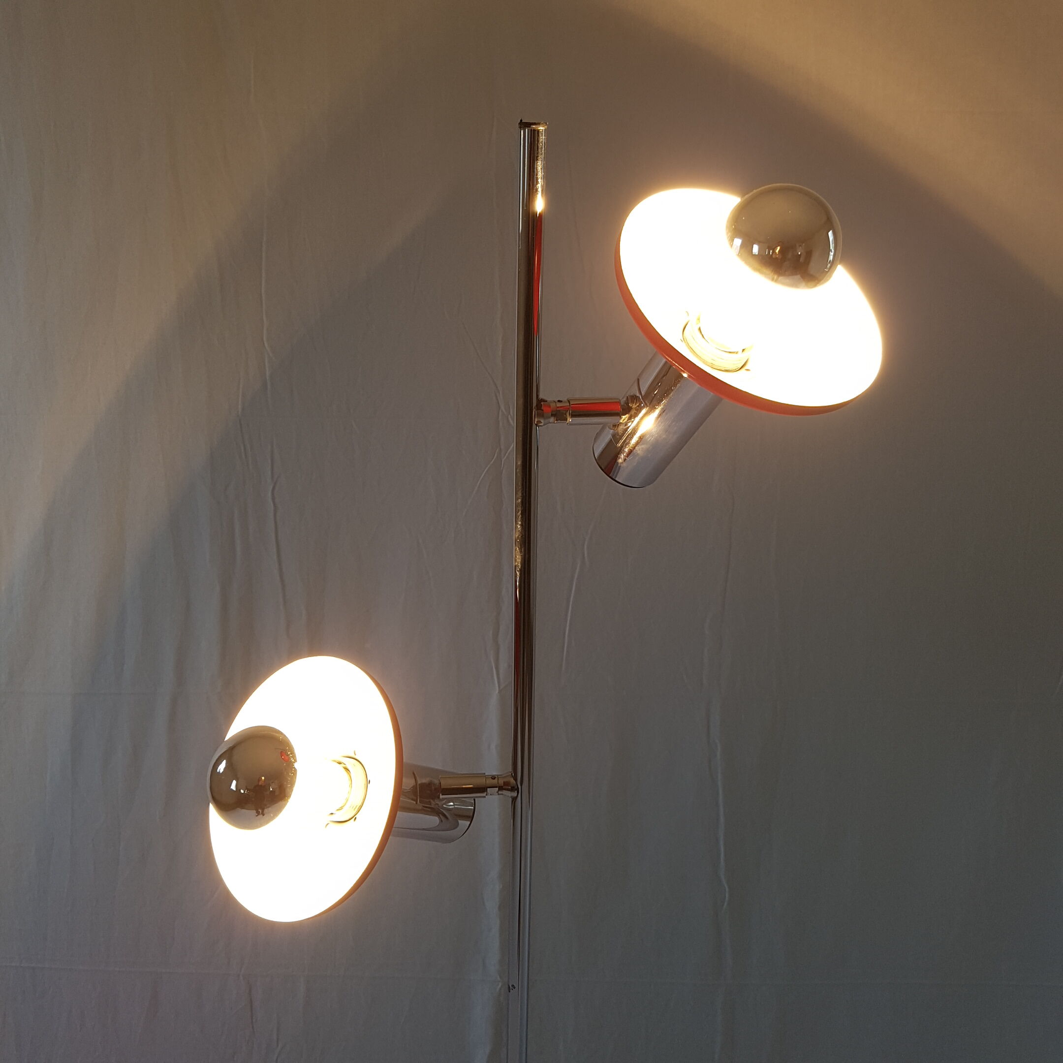 Two red lights and chrome floor lamp