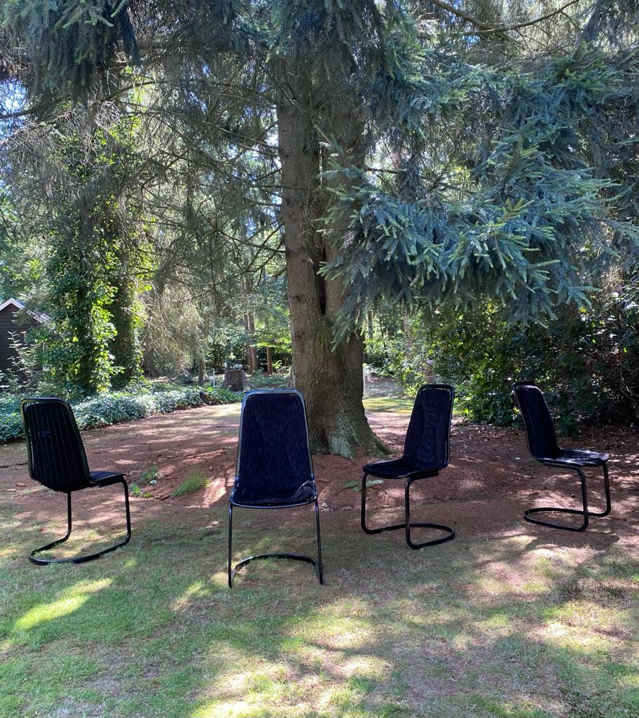 Set of four black highback dining chairs,  1970s