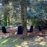 Set of four black highback dining chairs,  1970s