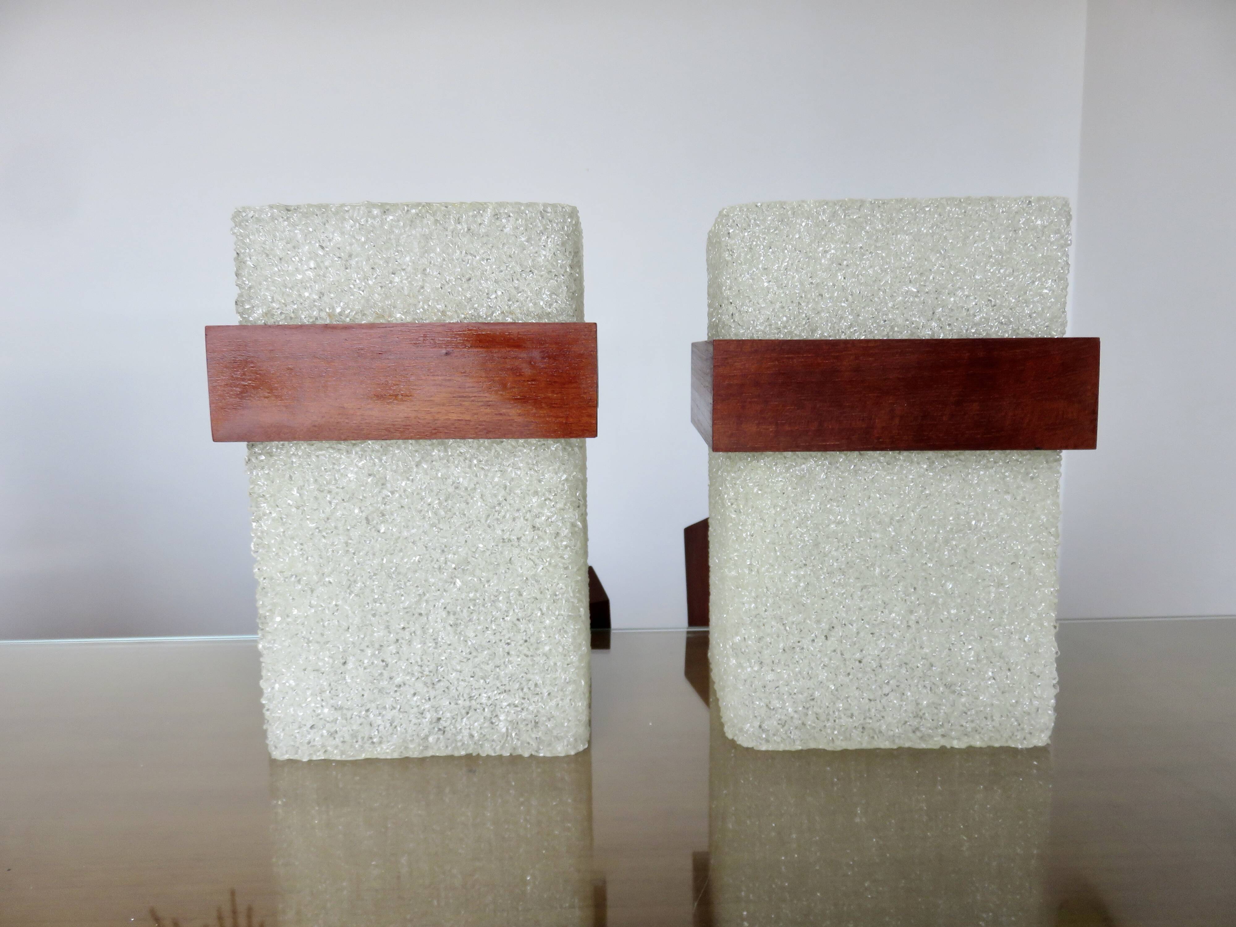 Pair of Scandinavian pendant lights in teak and perspex, 1970s.