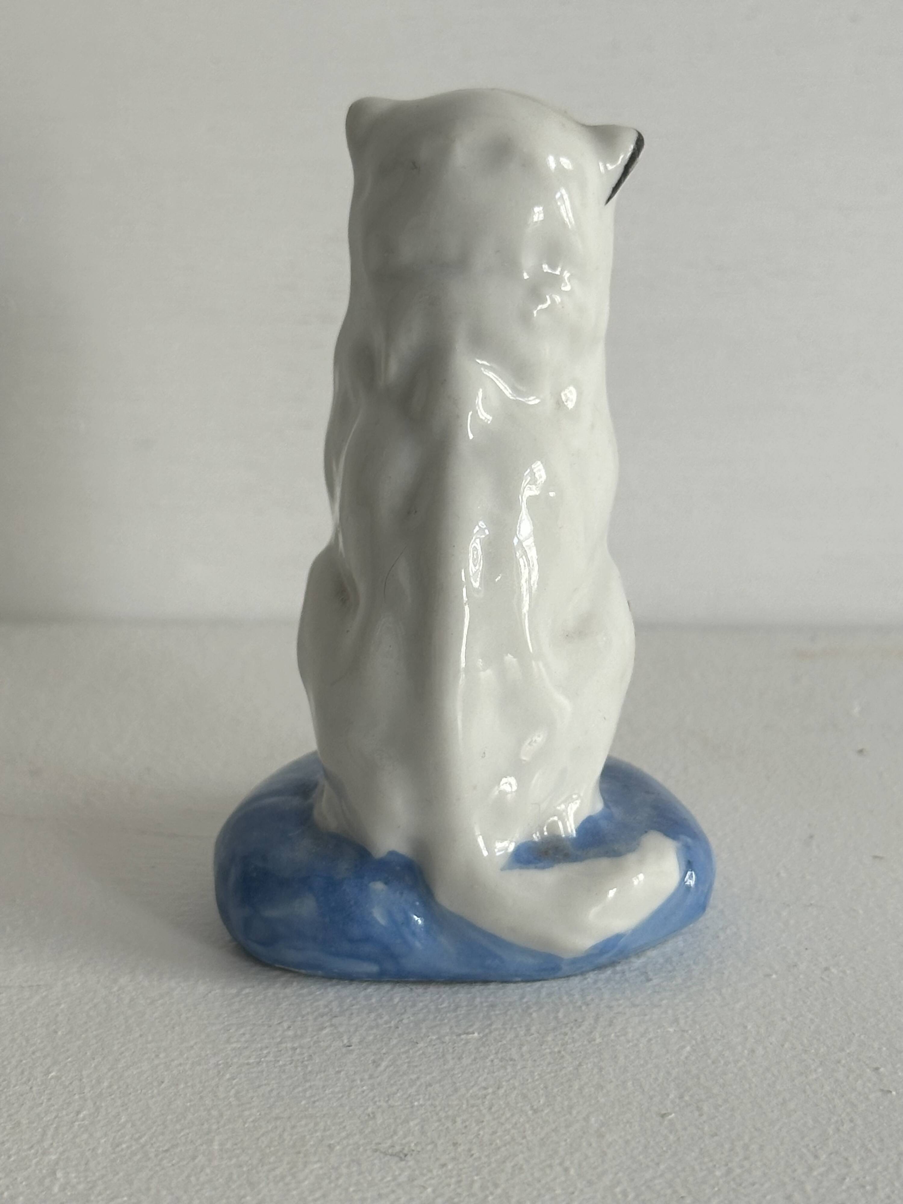 Small ancient glazed ceramic cat from the 19th century.