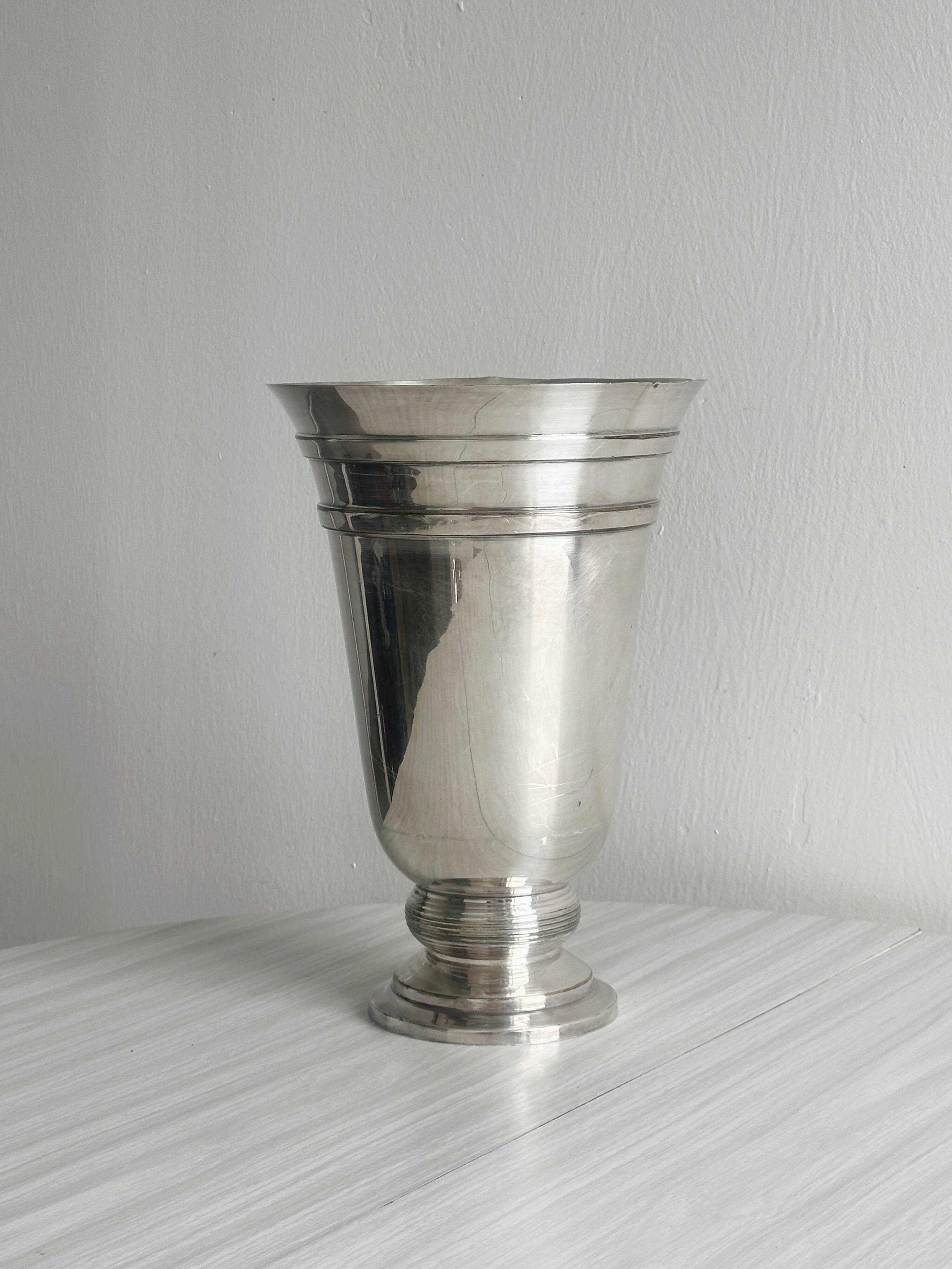 Antique shiny metal vase