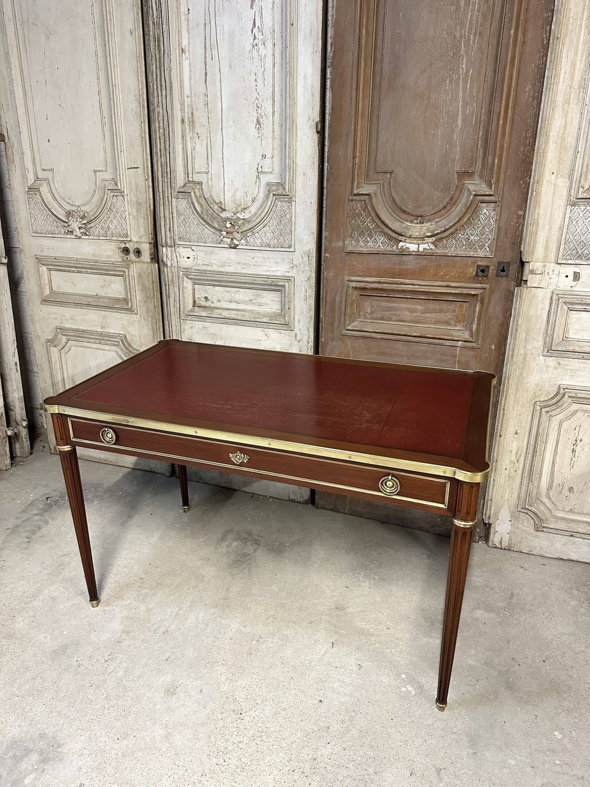 Louis XVI style flat desk in mahogany from around 1950.