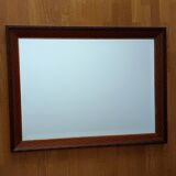 Beveled mirror, carved wood, gilded outline. 58x78x3 cm