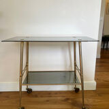 Vintage brass and smoked glass dessert trolley on wheels.