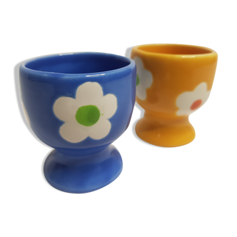 Pair of blue and yellow cockroaches with floral motifs