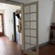 Triptych glass door with three panels featuring small panes. Vintage.