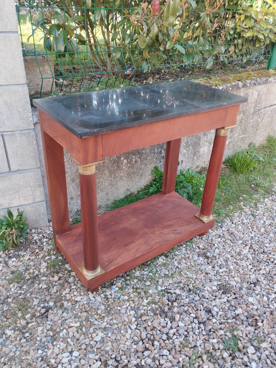 Console in old Empire style with a wooden frame and marble top.