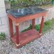 Console in old Empire style with a wooden frame and marble top.
