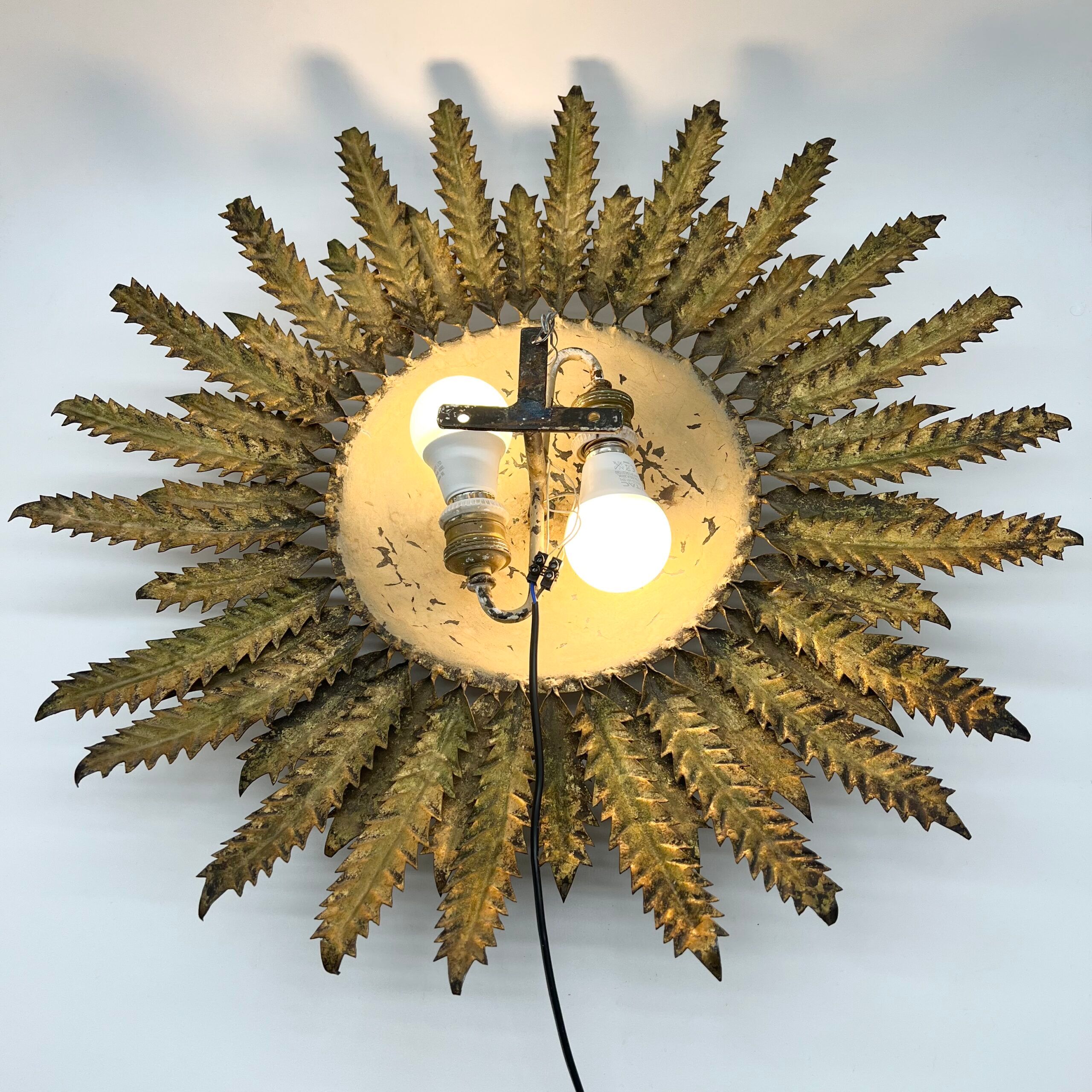 Large wall sconce "Sol" in gilded wrought iron – Spain, 1950s