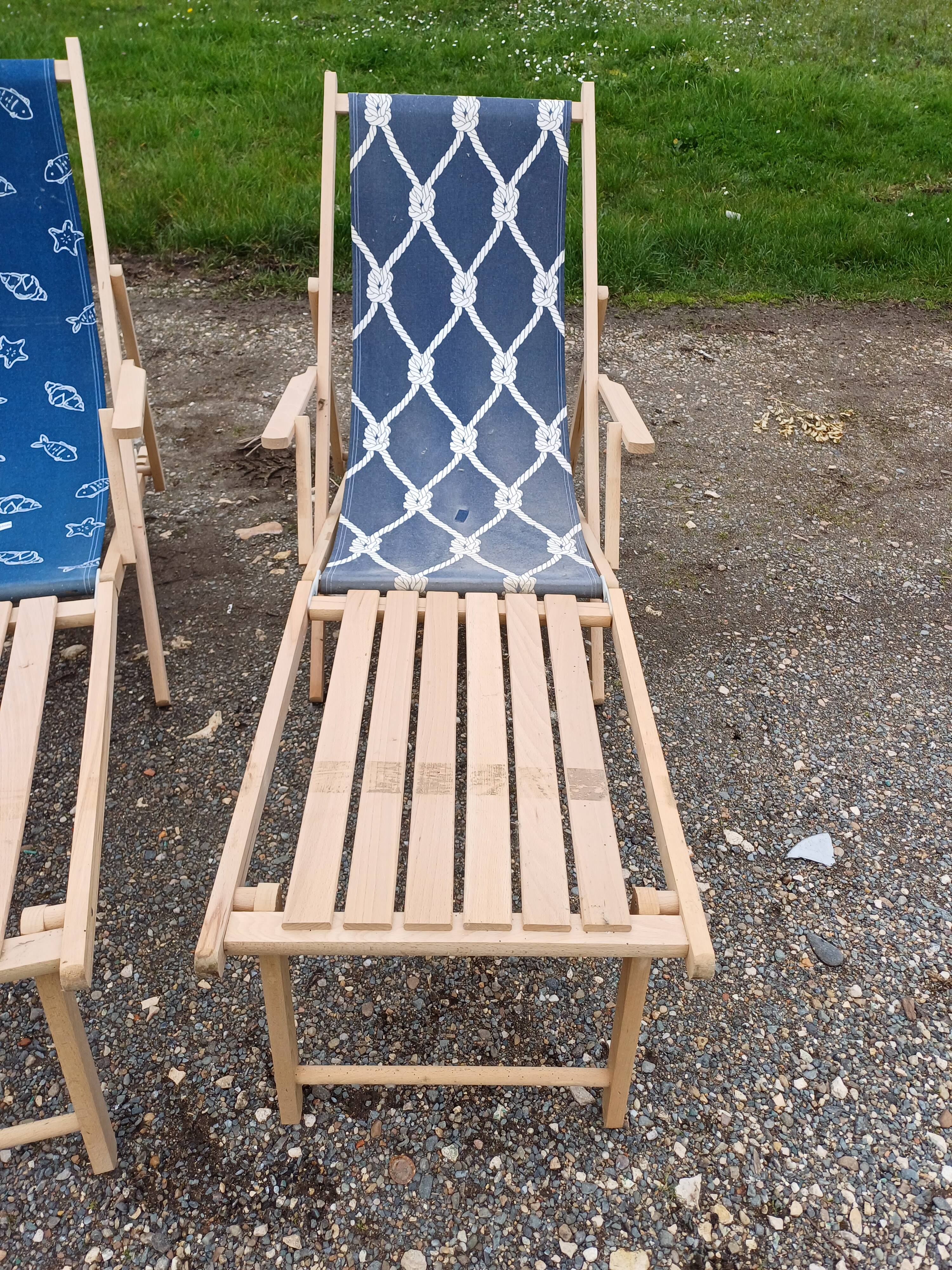 Pair of wood and fabric long chairs