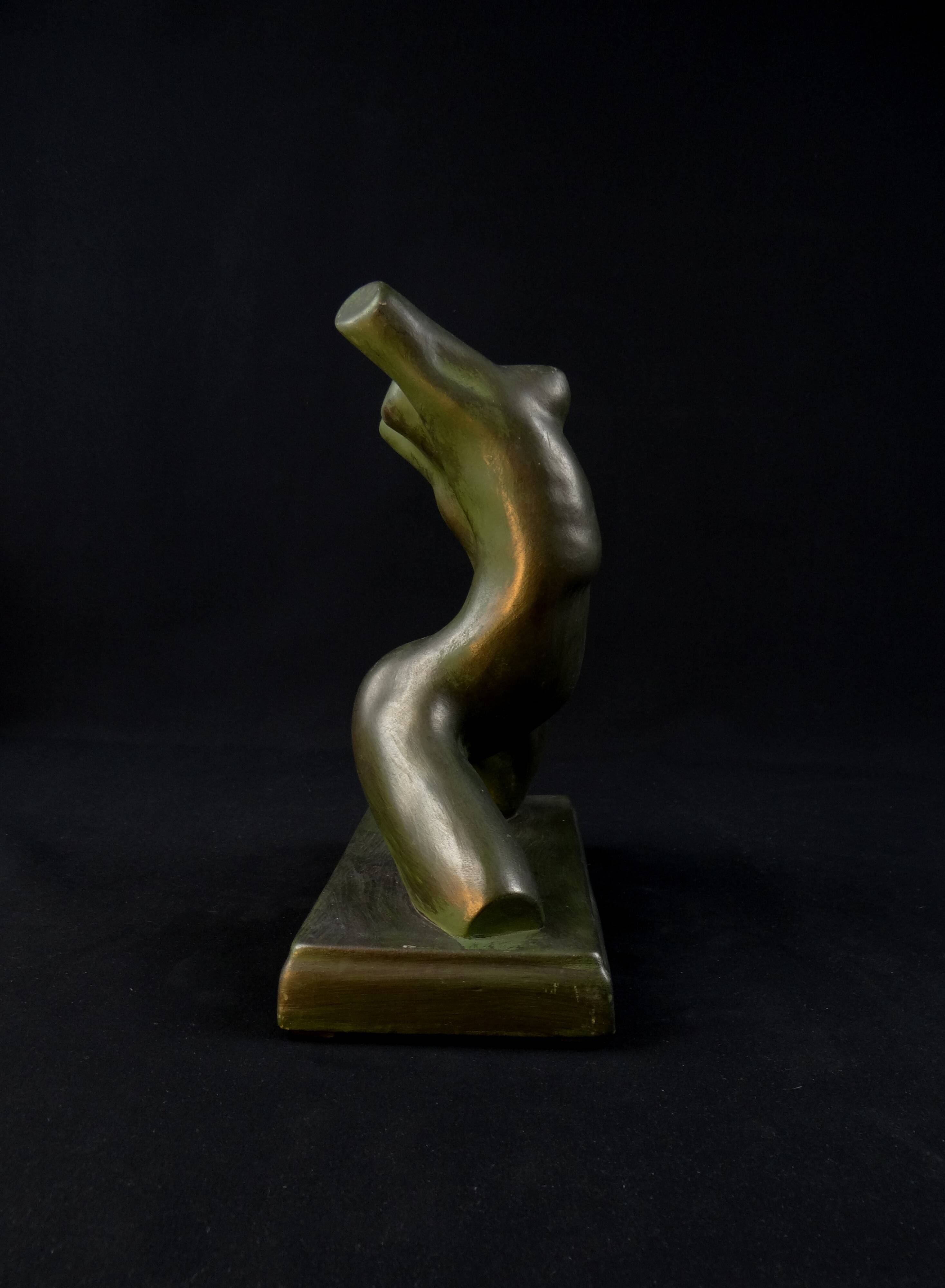 Modern sculpture of a nude woman in green ceramic, signed Carlos Nazareth
