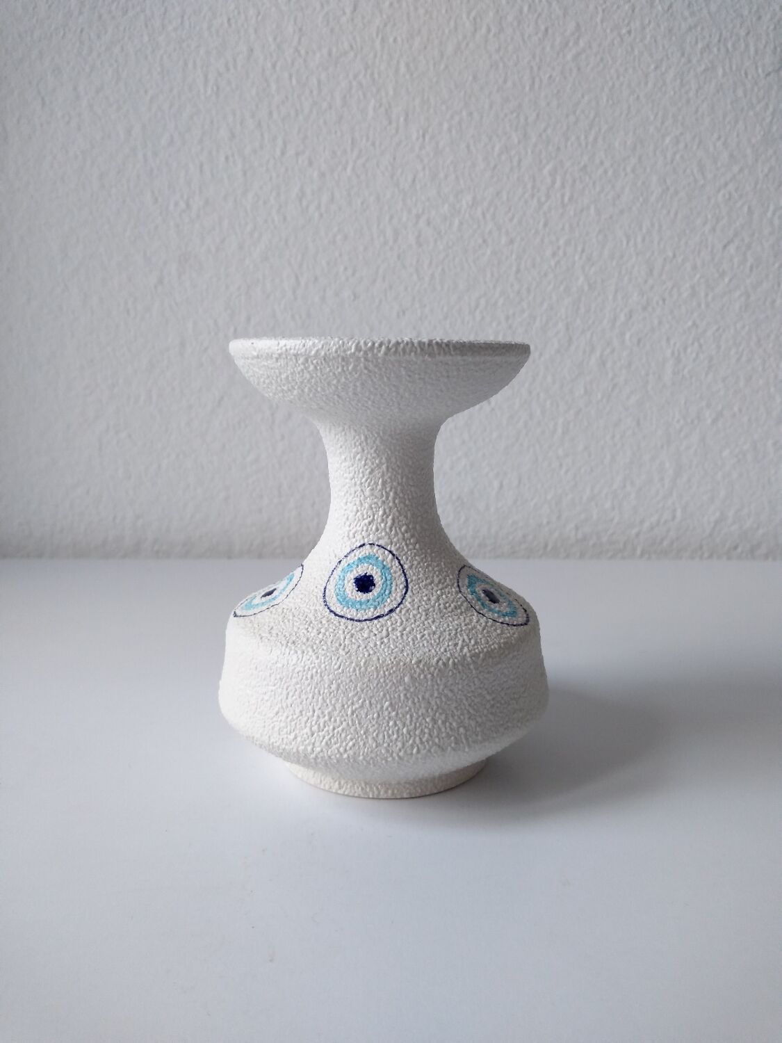 White and blue ceramic vase with italian relief