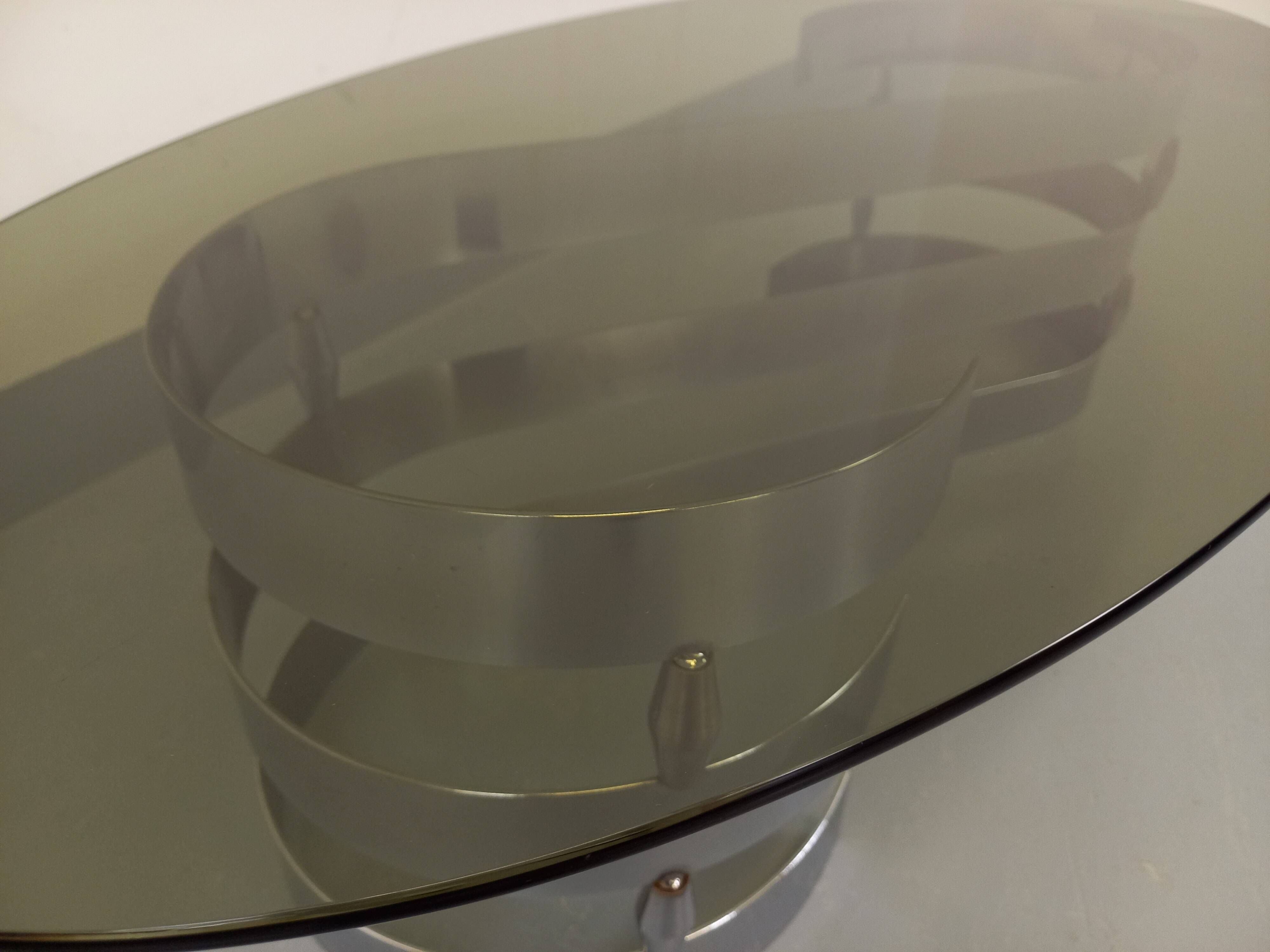 Vintage oval coffee table in smoked glass and chrome metal from the 1970s.