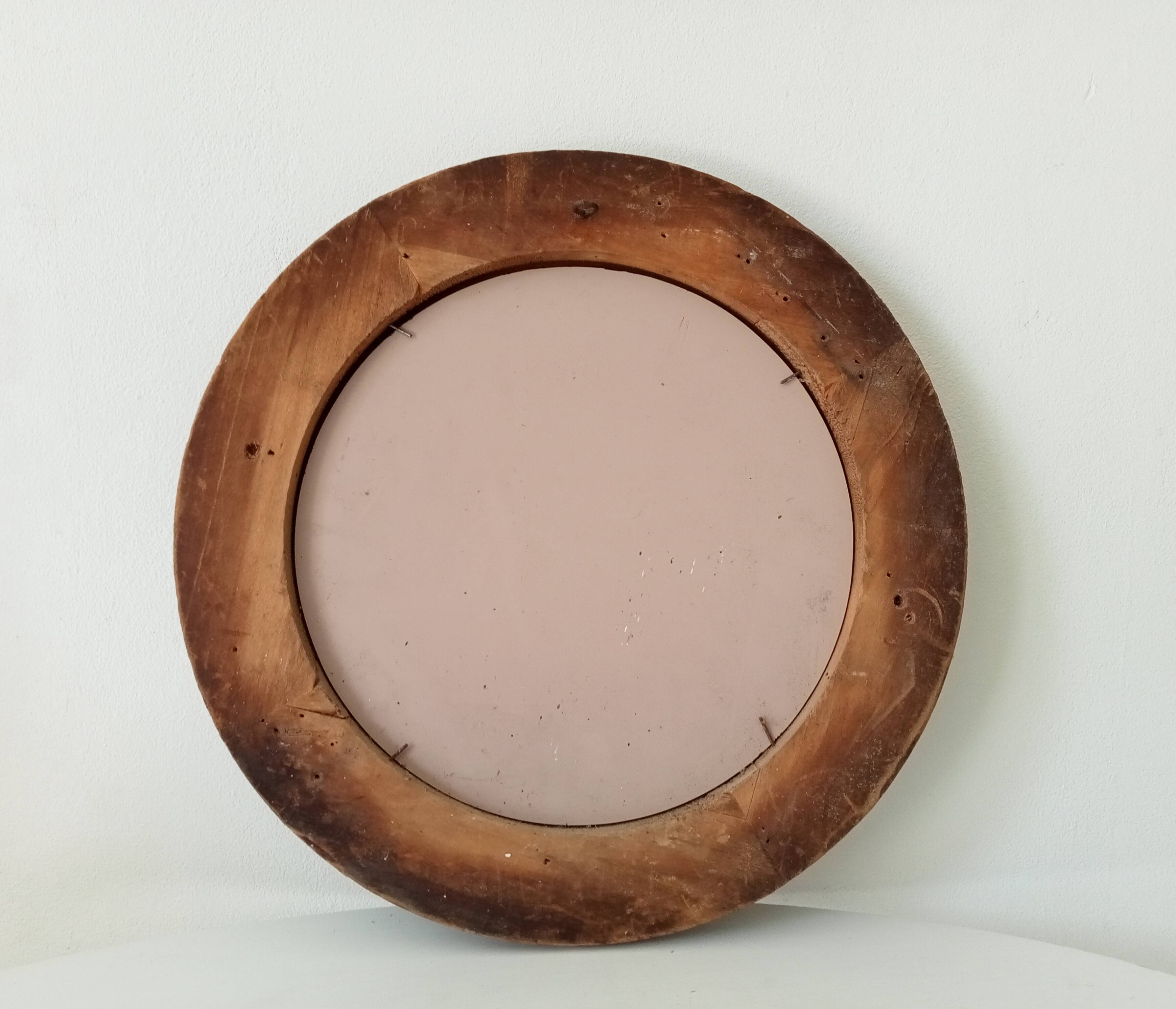 Antique round wooden mirror