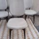 Set of 4 white and wooden Scandinavian chairs.