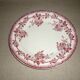 Beige earthenware plate with rose decoration and red garlands
