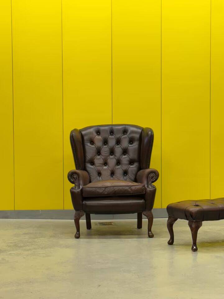 Dark Brown leather chesterfield wing chair with Ottoman