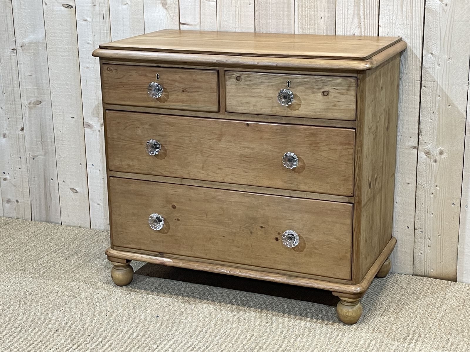 English chest of drawers in nineteenth century fir with its glass buttons