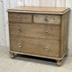 English chest of drawers in nineteenth century fir with its glass buttons