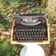 Silver reed orange and black typewriter with bag