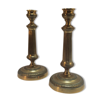 Pair of empire-era candlesticks in brass
