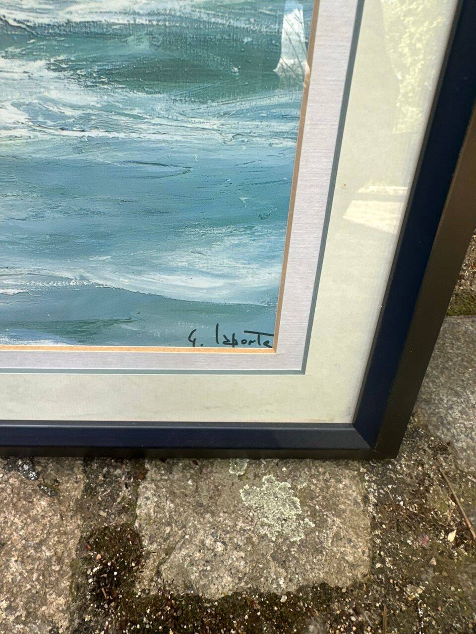 Framed oil painting on canvas of a seascape signed by Georges Laporte.