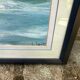 Framed oil painting on canvas of a seascape signed by Georges Laporte.