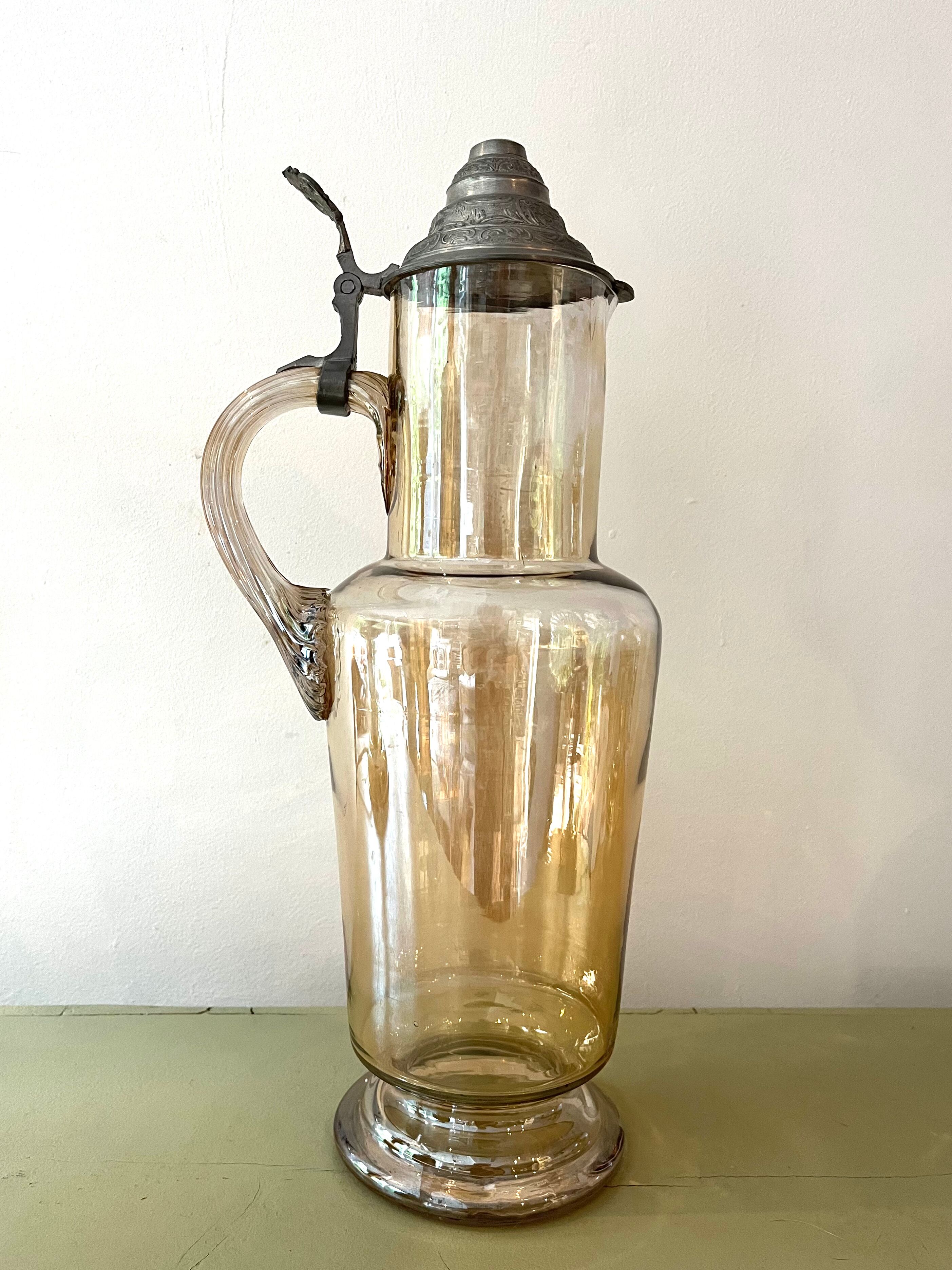 Vintage glass and tin jug