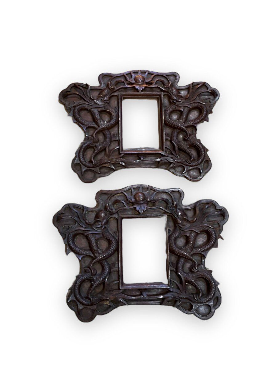 Pair of exotic wooden frames with dragons