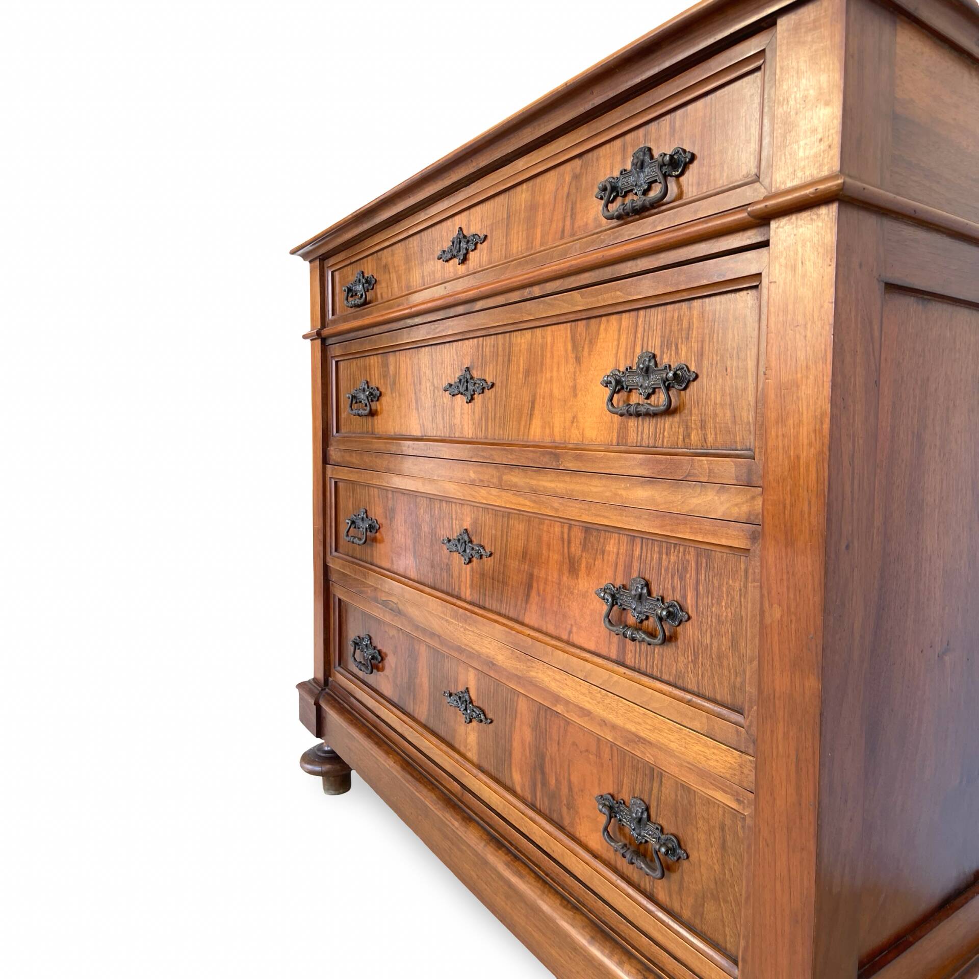 Antique walnut commode with bronze handles in the shape of a lion's mask,