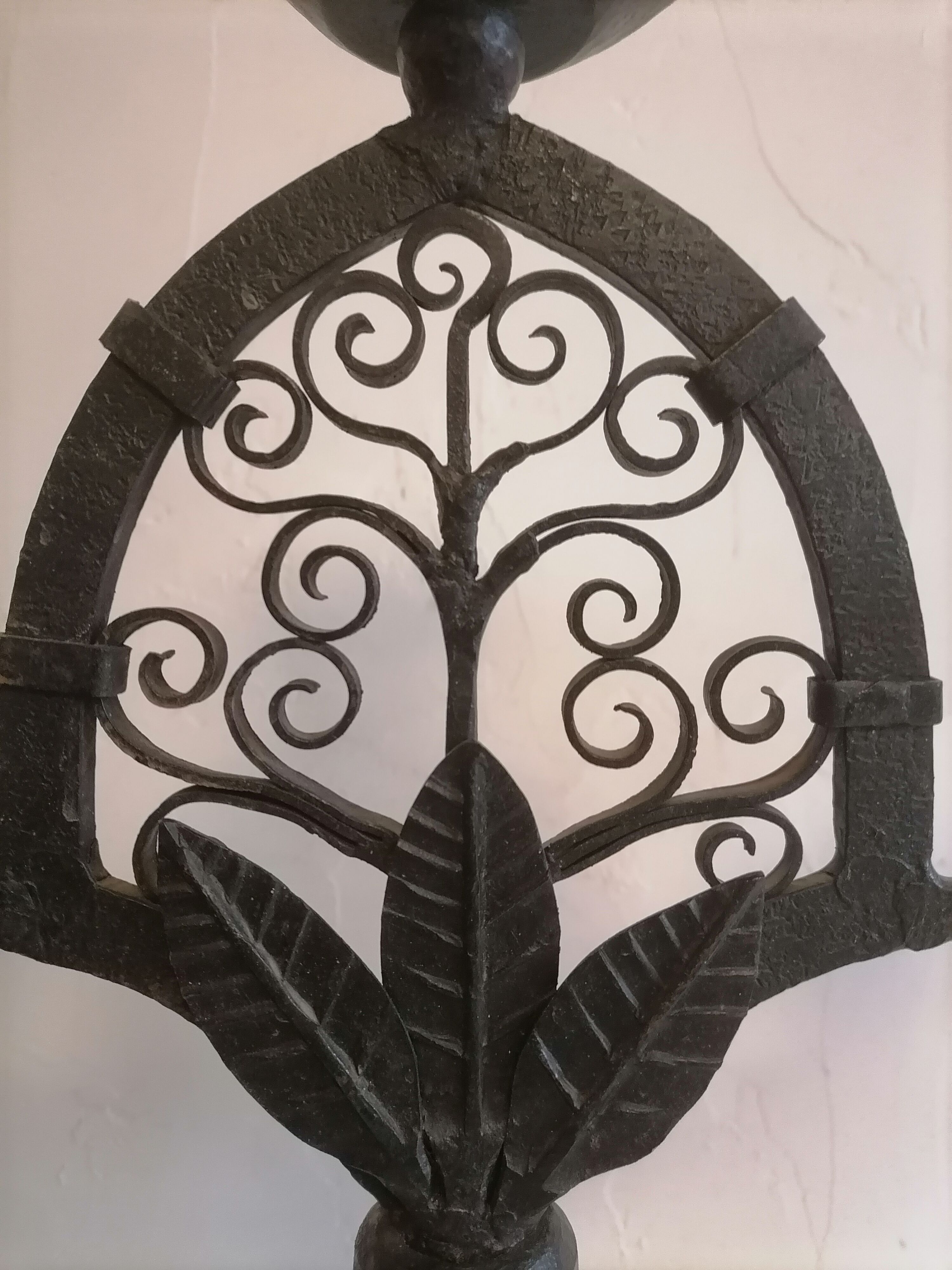 Pair of wrought iron candelabras. Mid-twentieth century.