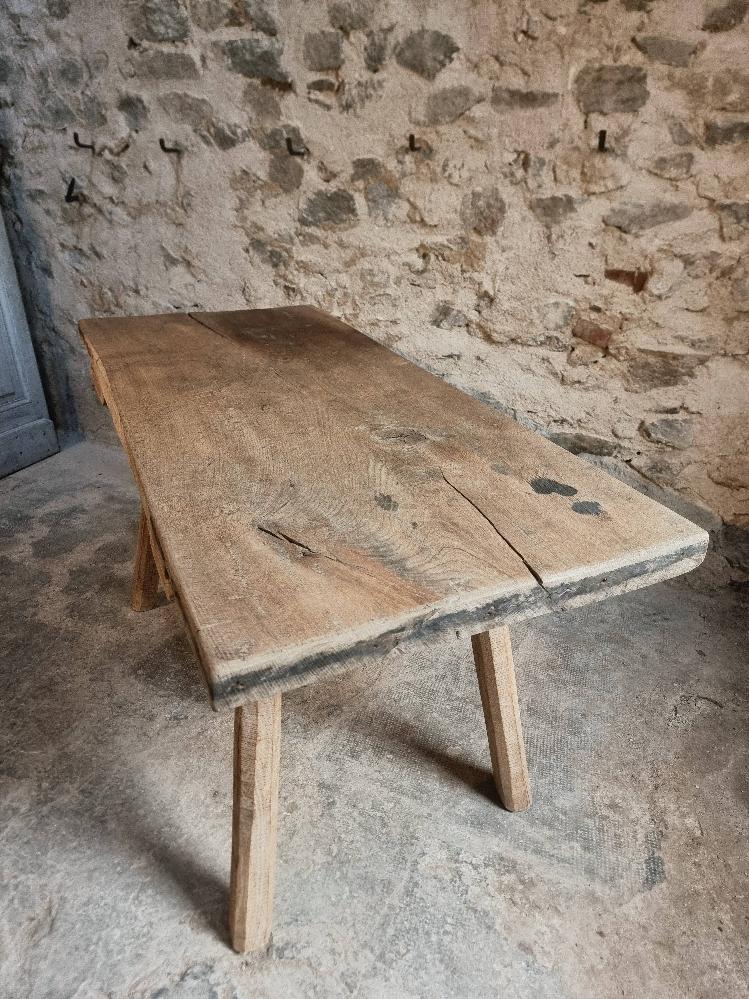 Antique work table / primitive dining table in oak, Hungary, circa 1900–1930.