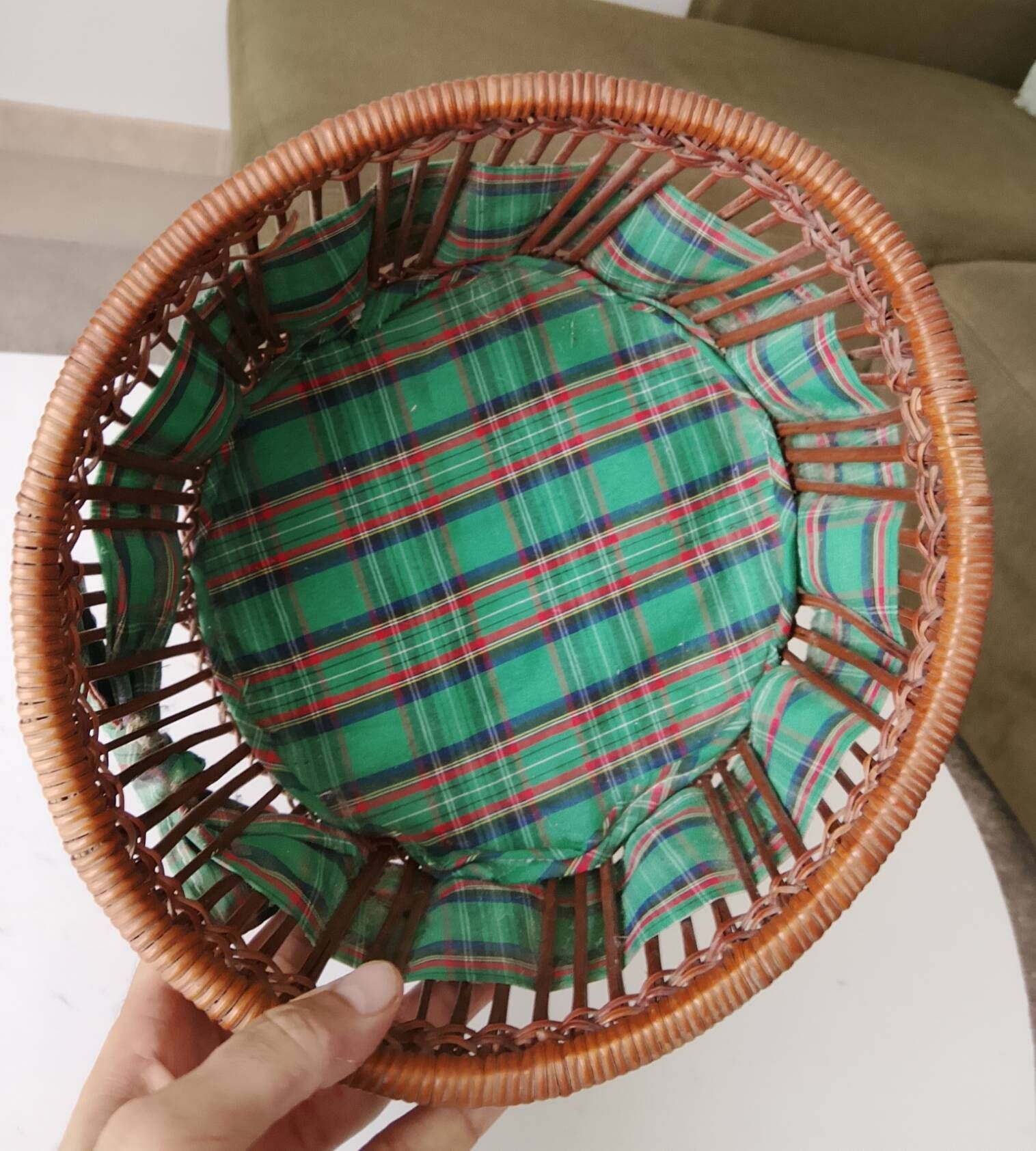 Vintage wicker and rattan basket with tartan fabric.