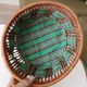 Vintage wicker and rattan basket with tartan fabric.