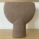 Vintage vase made of raw clay