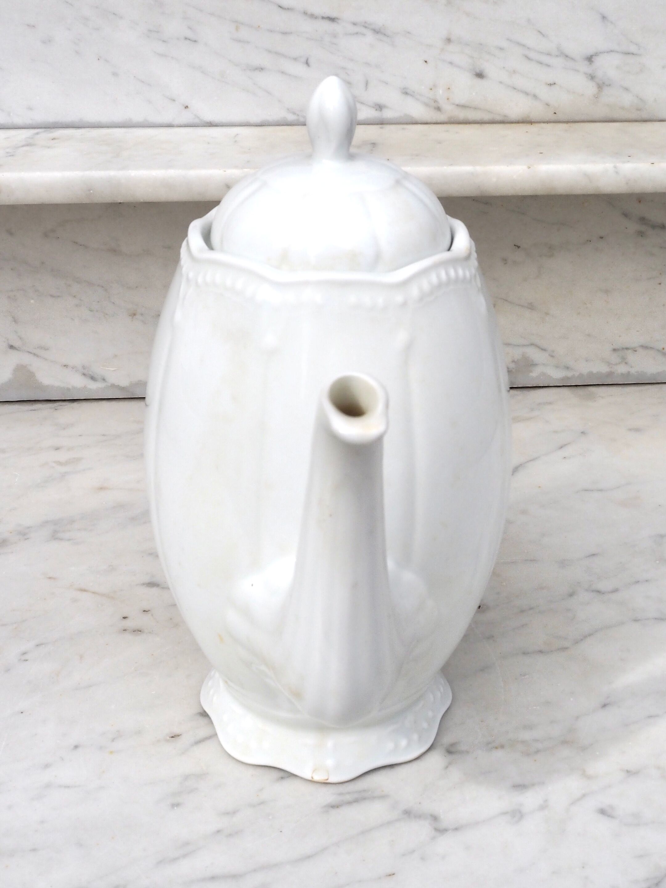 Worked white porcelain coffee maker