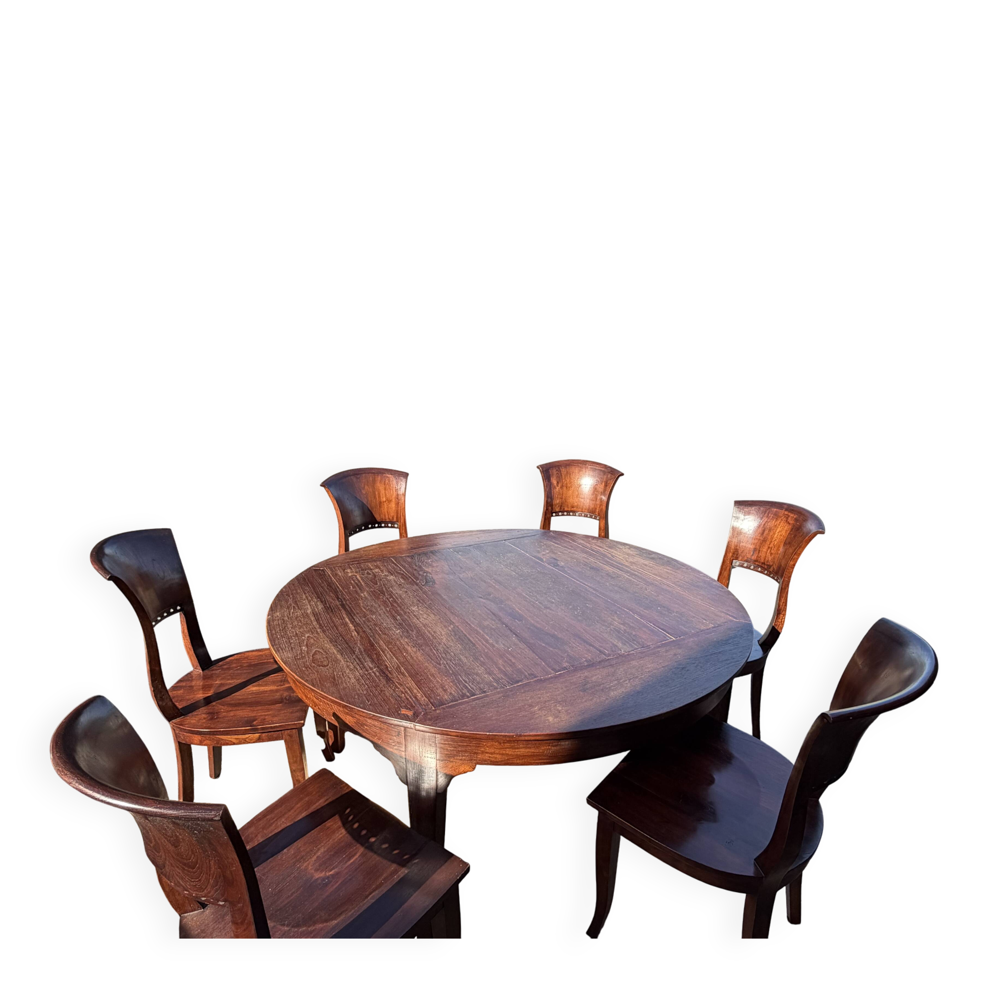 Round teak table 150 cm with 6 Indonesian chairs.