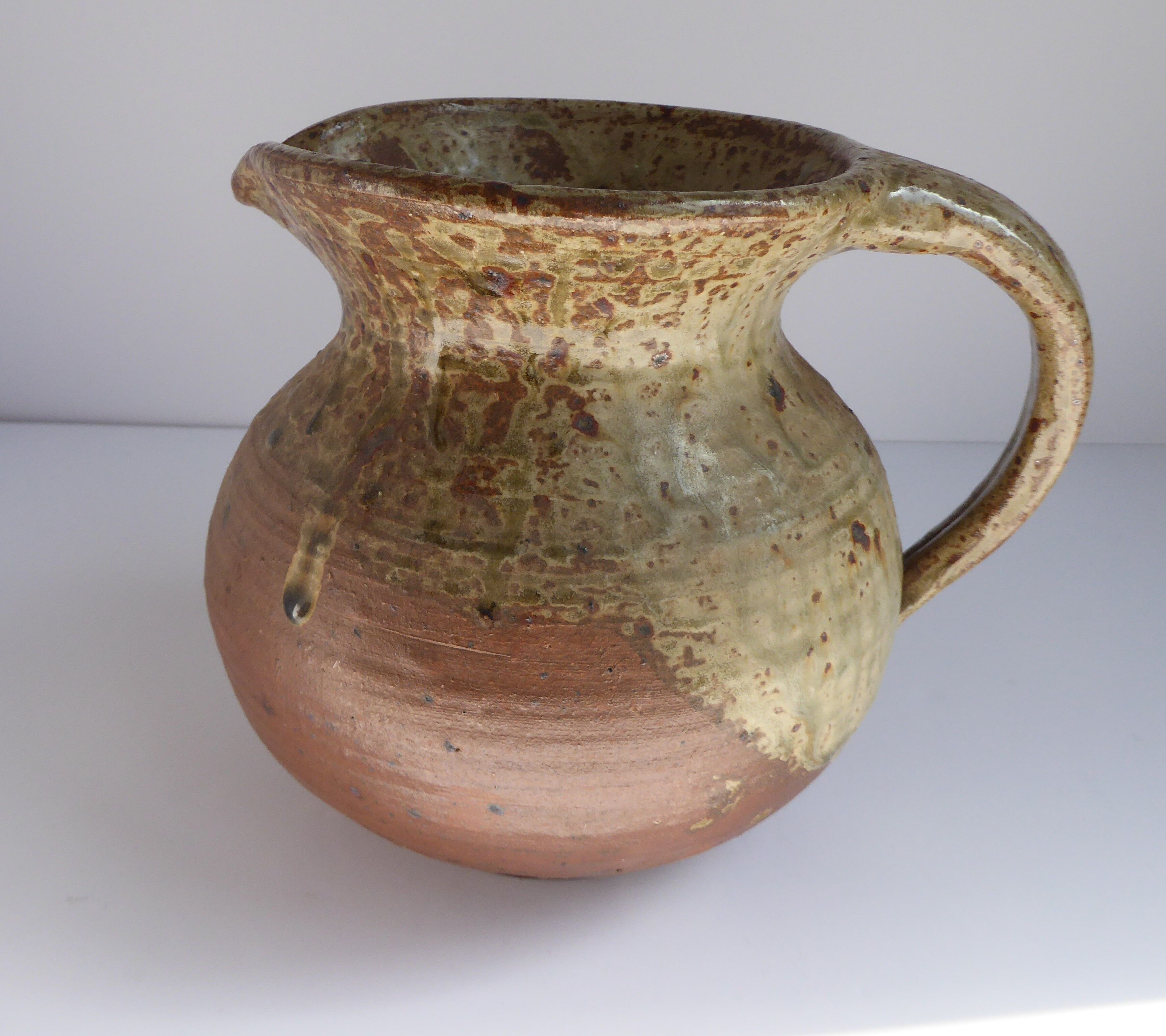 Signed vernissé sandstone pitcher