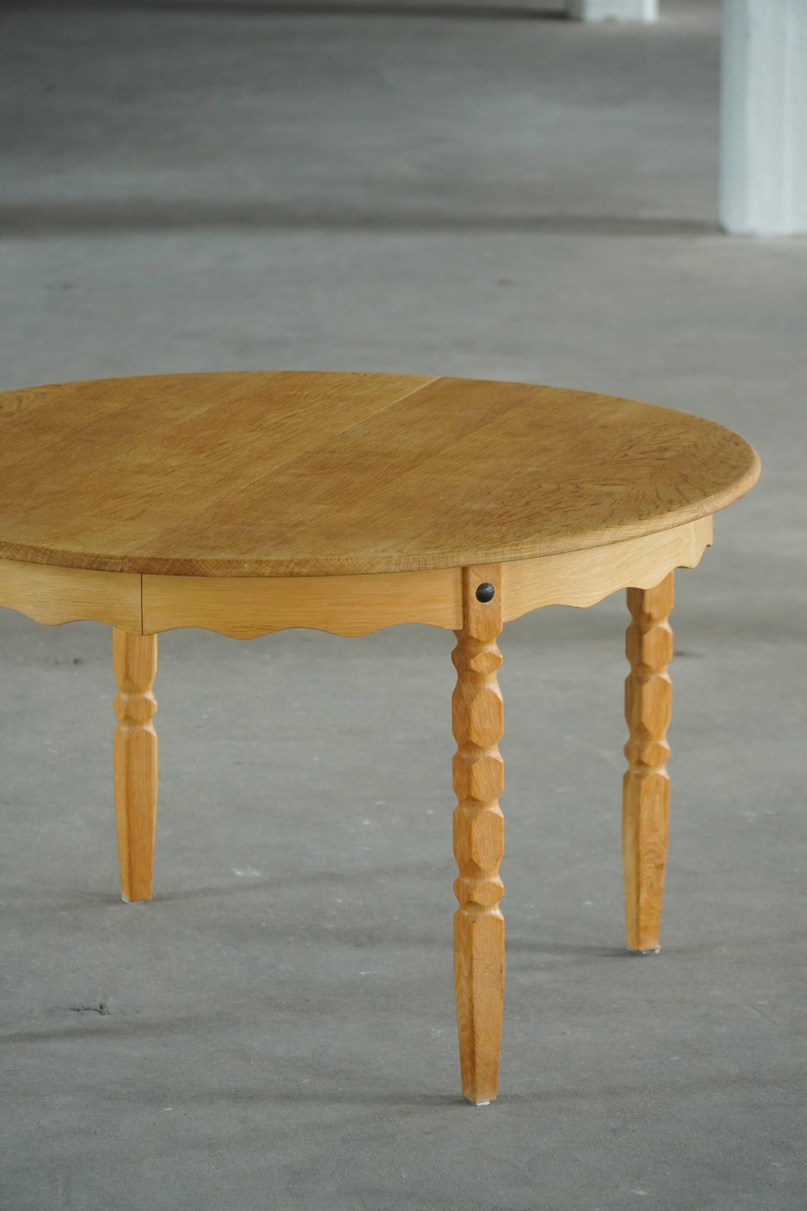 Round solid oak dining table with three extensions, mid-century Danish style, 1960s.