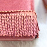 Pink velvet pouf with fringes