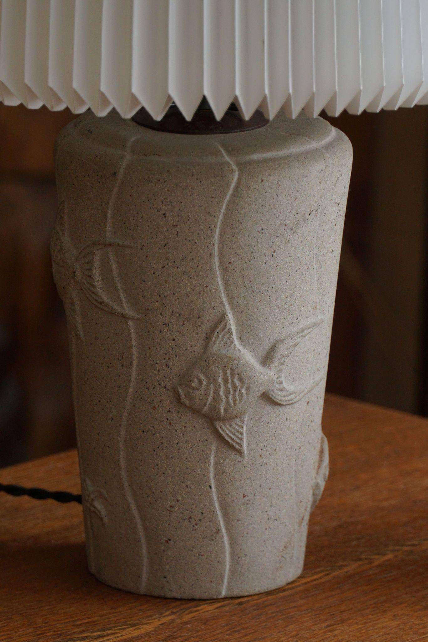 Modern vintage French table lamp, made of stone with fish patterns, 1970s.