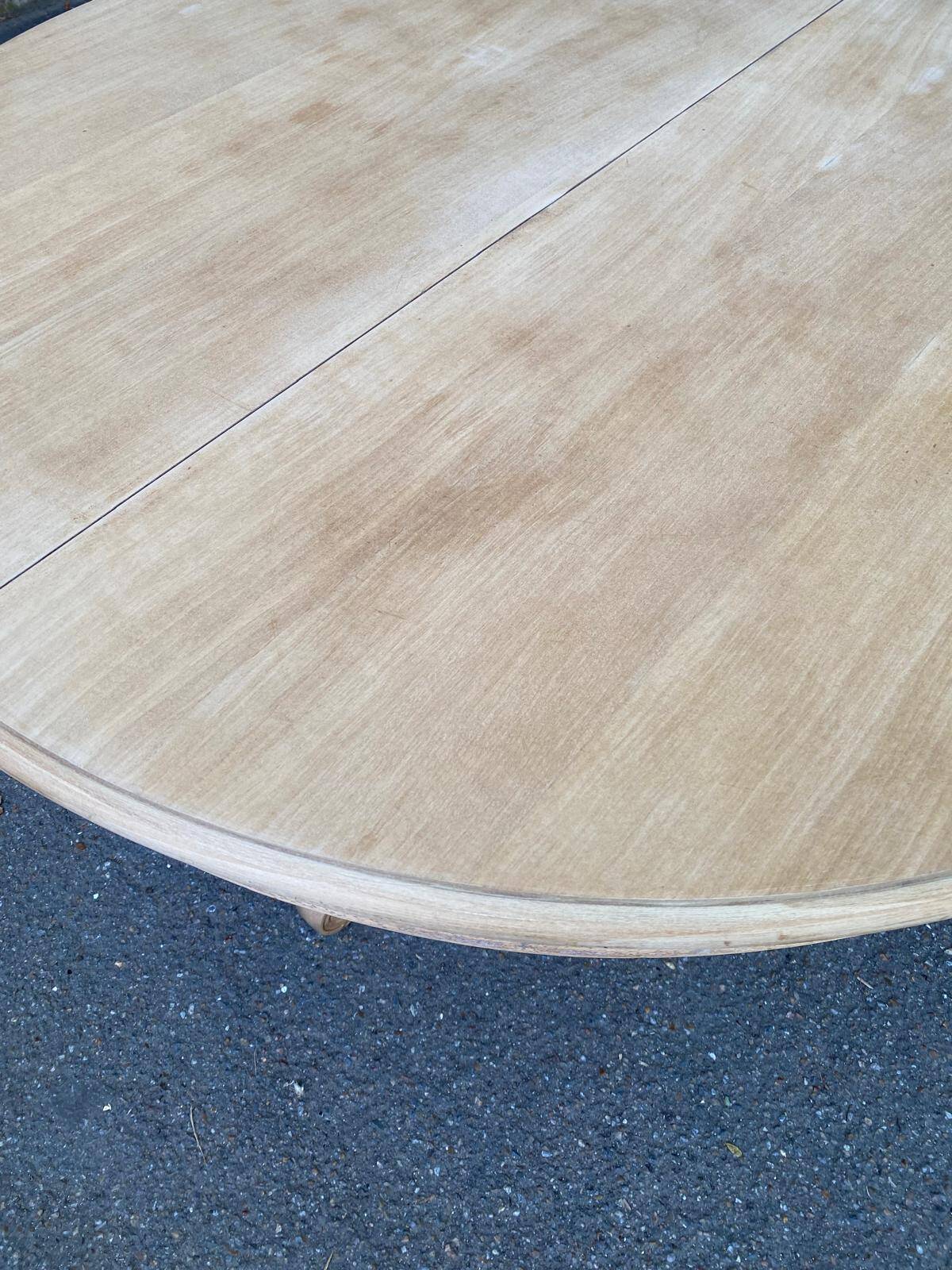 Extendable round dining table with central art deco leg, renovated in raw wood