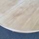 Extendable round dining table with central art deco leg, renovated in raw wood