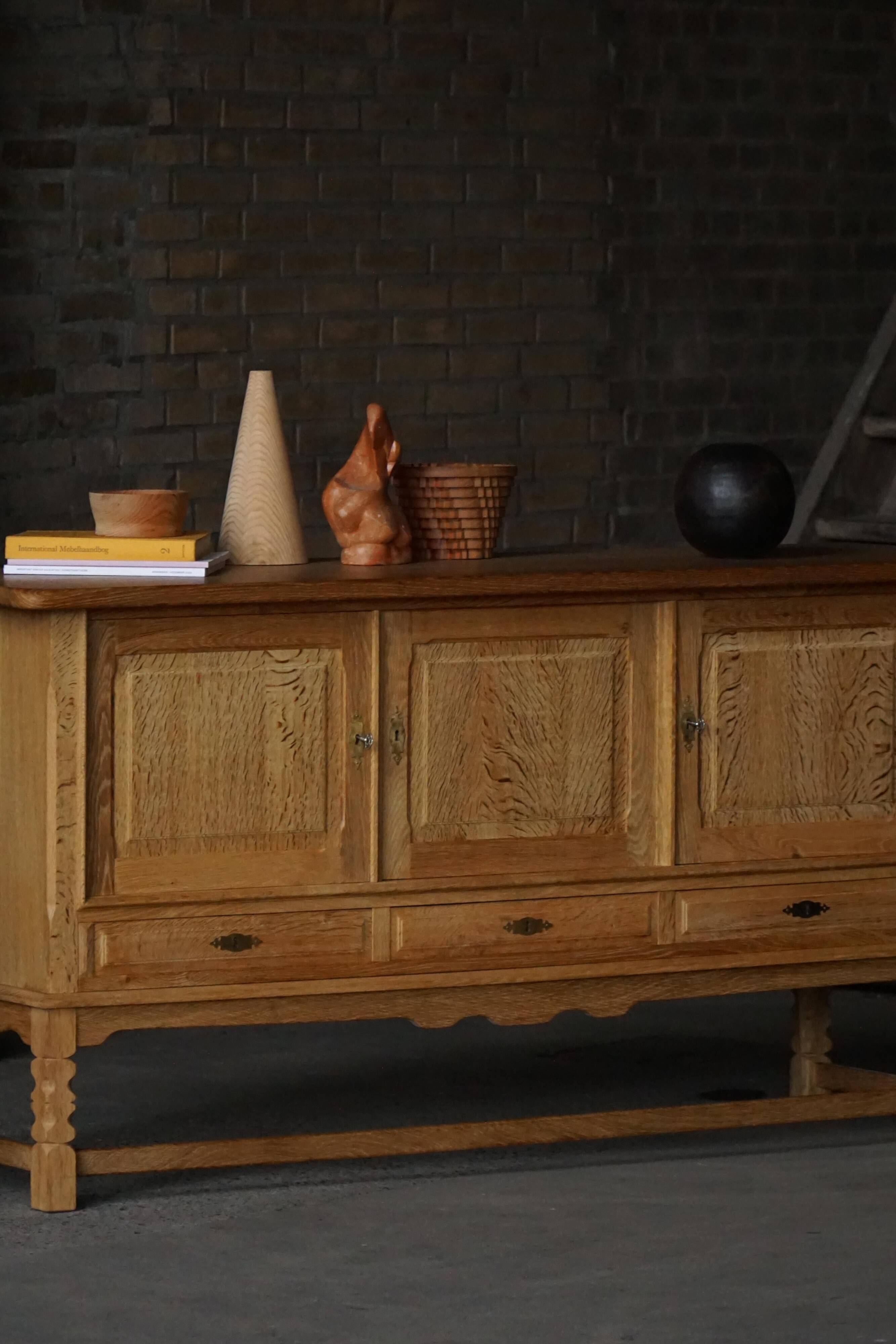 Brutalist Danish enfilade from the mid-century in oak by Henning Kjærnulf, 1960s.