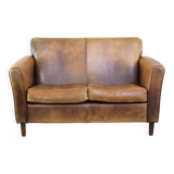 Charming 2-seater designer sofa made of sheep leather with a rustic look