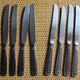 Mismatched set of 8 forks + 8 vintage shell stainless steel knives