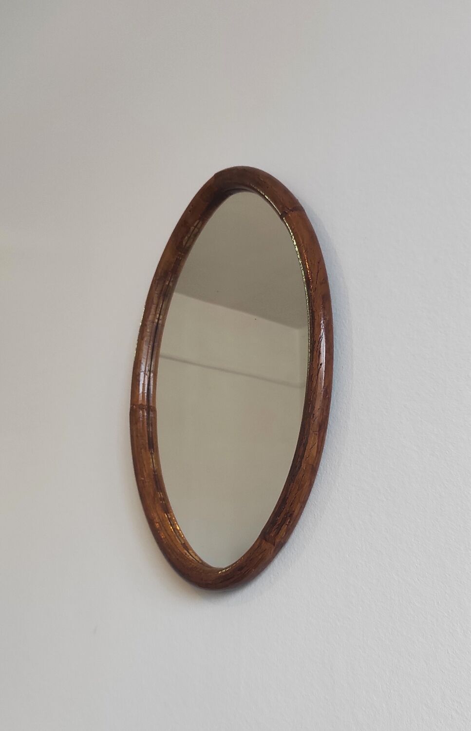 Vintage oval rattan mirror