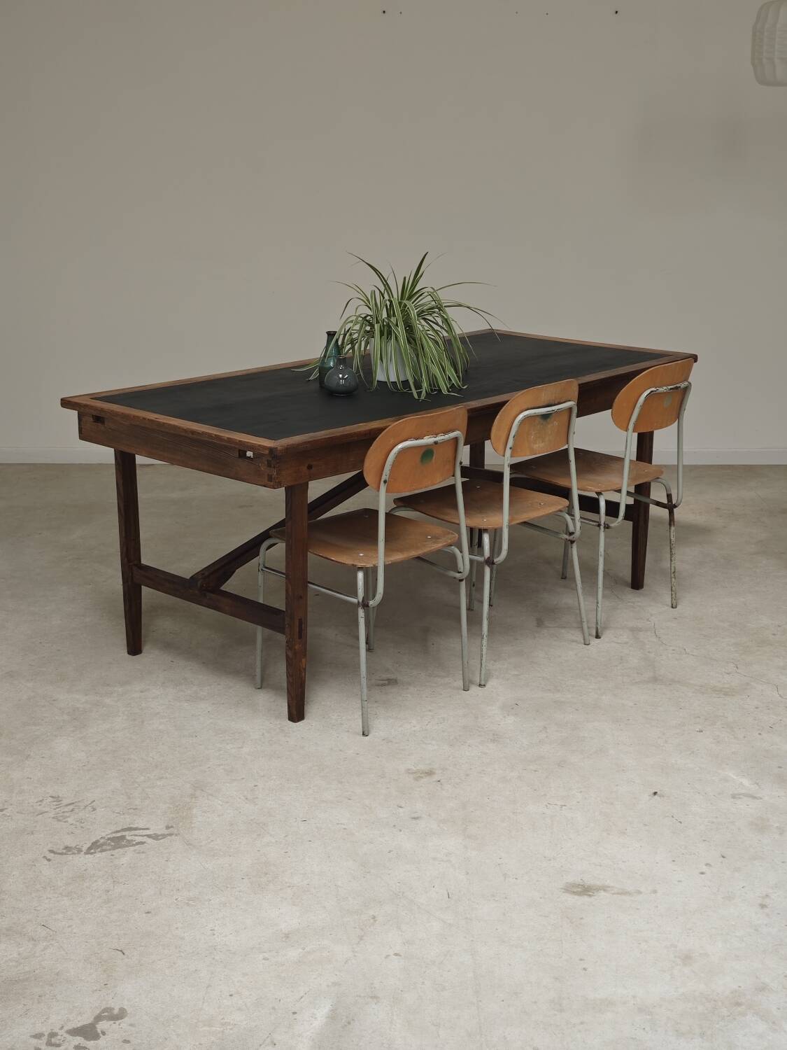 Vintage workshop folding table in oak with a hand-patinated black top.