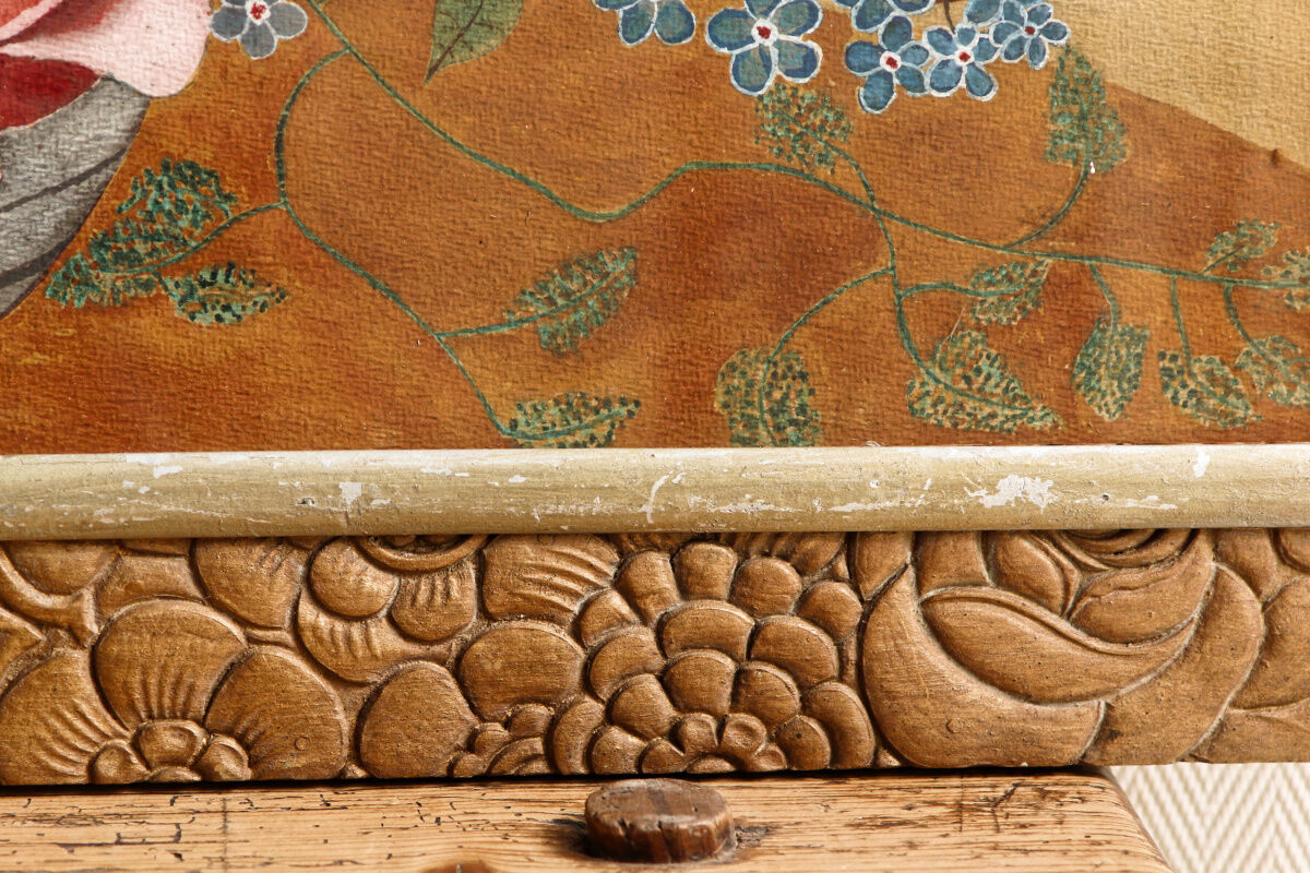 Bouquet of flowers in carved art deco frame